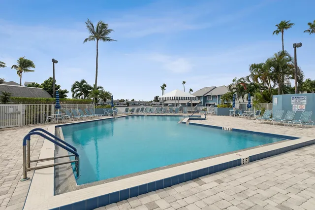a view of a swimming pool with a lake view