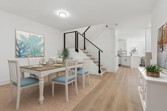 a view of a dining room with furniture window and wooden floor
