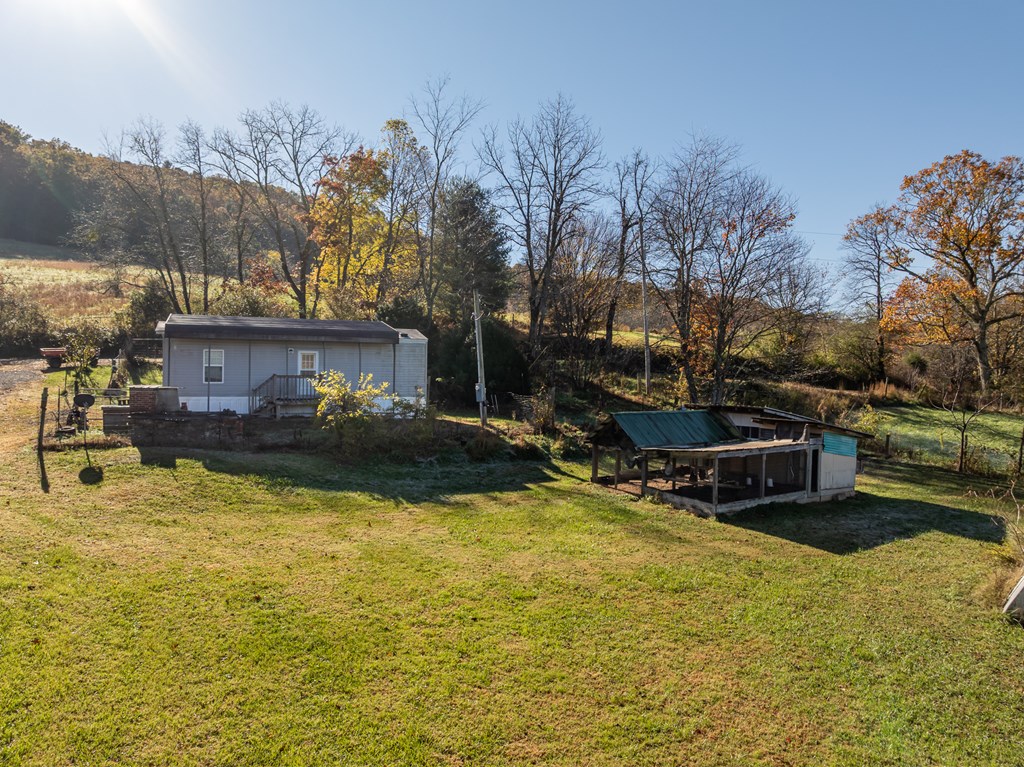 336 Old Skeenah Gap Road Suches, GA 30572 - Photo 30 of 81 a view of a house with swimming pool and sitting area