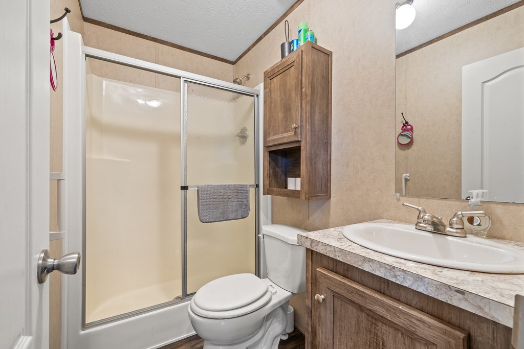 336 Old Skeenah Gap Road Suches, GA 30572 - Photo 38 of 81 a bathroom with a sink toilet and shower