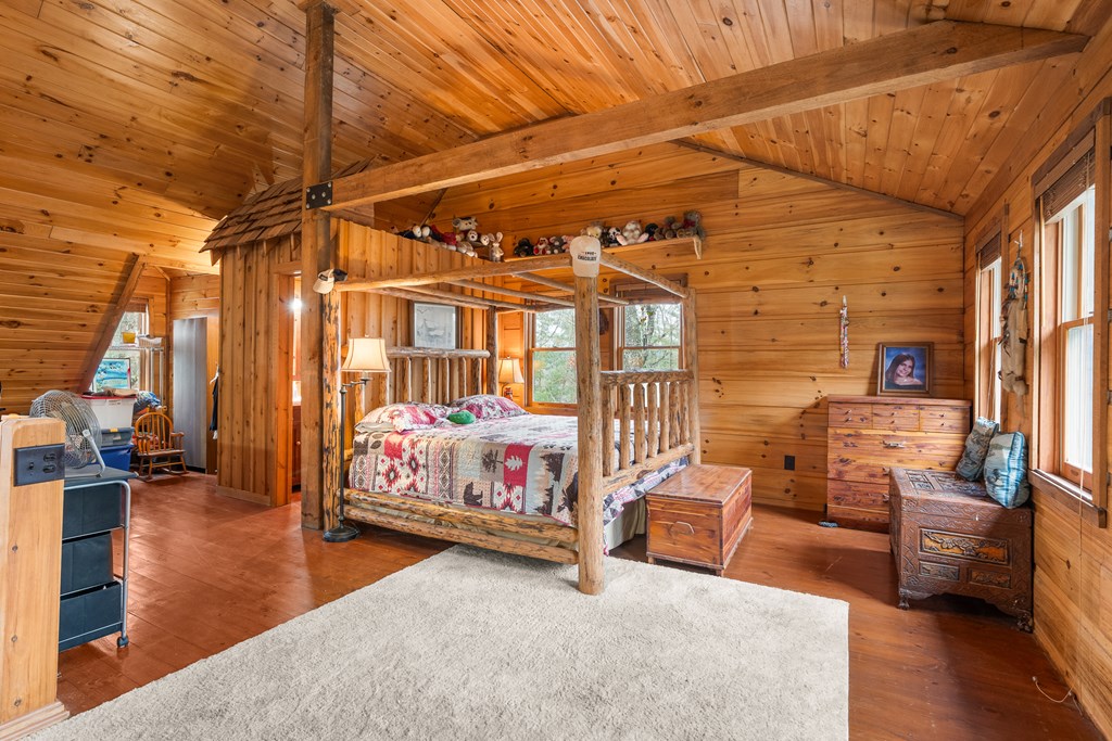 336 Old Skeenah Gap Road Suches, GA 30572 - Photo 47 of 81 a bedroom with furniture and wooden floor
