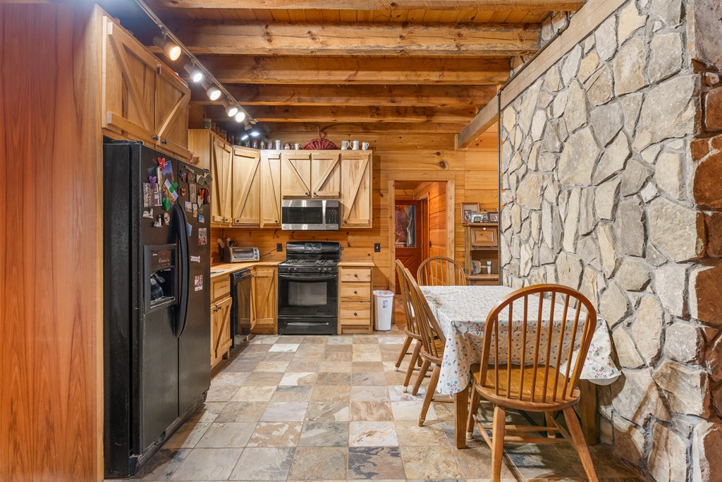 336 Old Skeenah Gap Road Suches, GA 30572 - Photo 59 of 81 a view of a kitchen with furniture and refrigerator