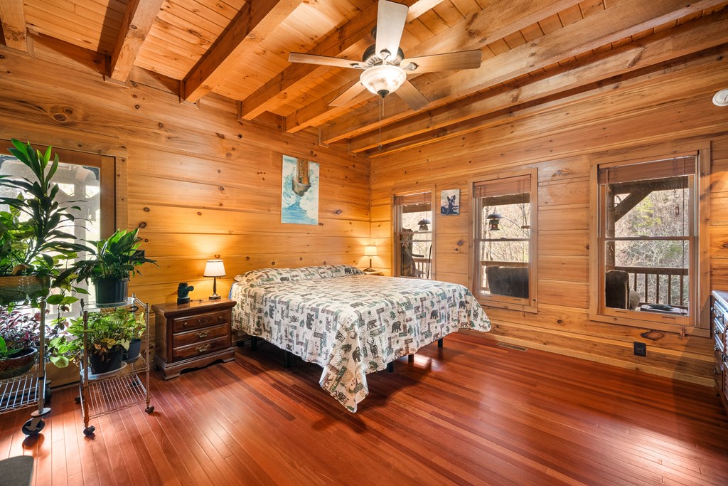 336 Old Skeenah Gap Road Suches, GA 30572 - Photo 63 of 81 a bedroom with a bed and wooden floor
