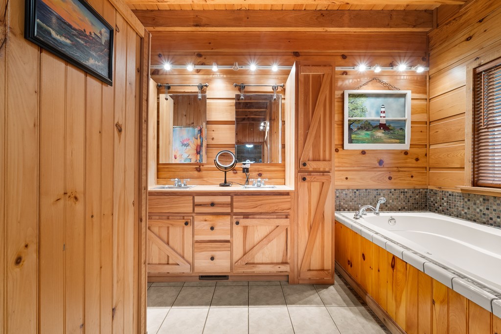 336 Old Skeenah Gap Road Suches, GA 30572 - Photo 67 of 81 a bathroom with a granite countertop sink and mirror