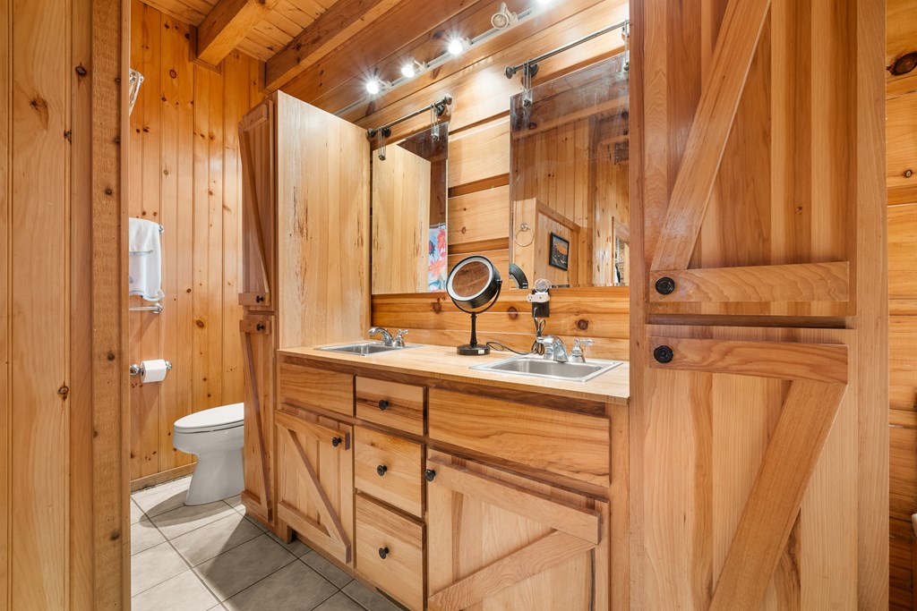 336 Old Skeenah Gap Road Suches, GA 30572 - Photo 68 of 81 a bathroom with a sink a toilet and shower