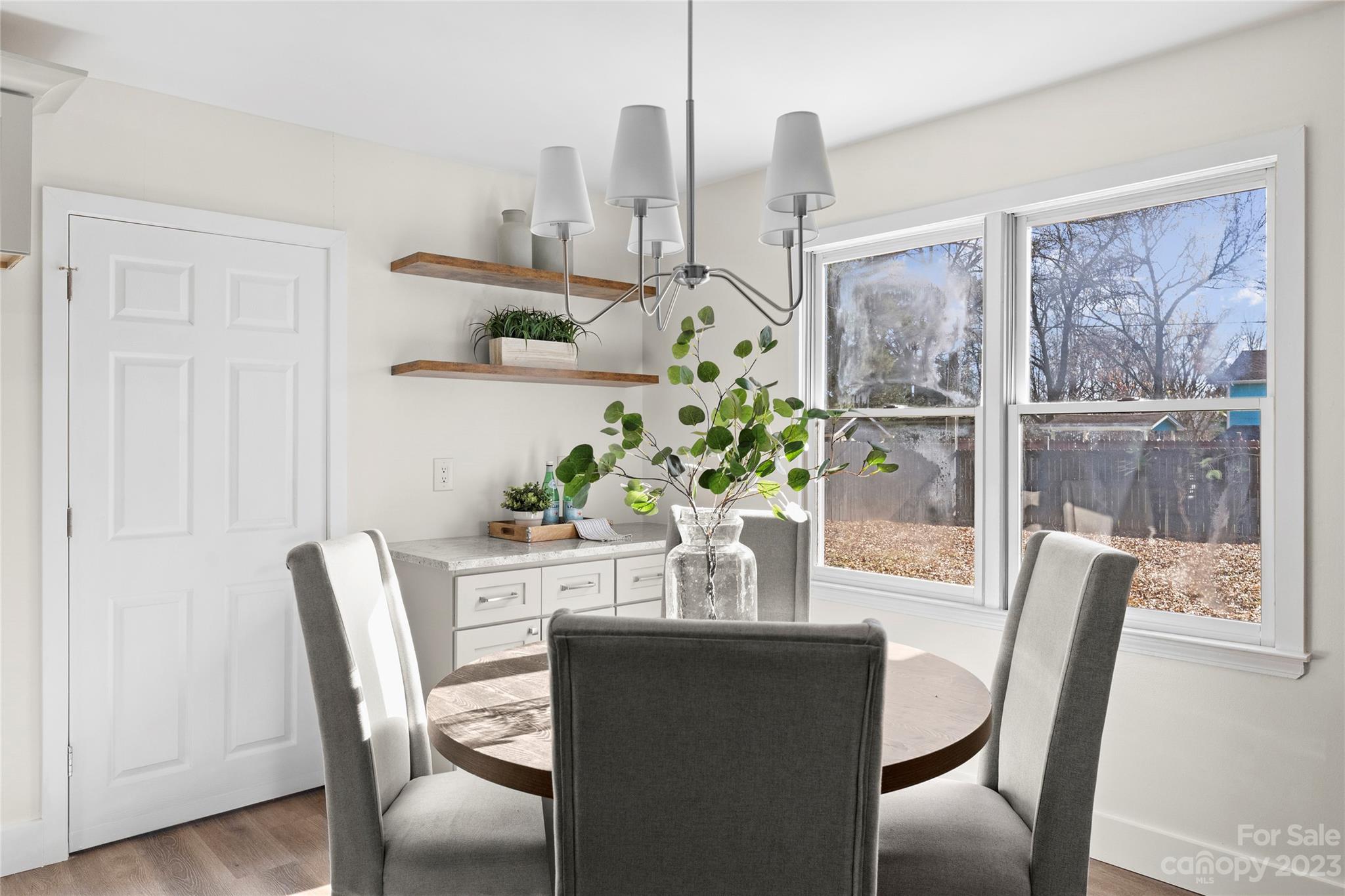 1621 Brook Drive Fort Mill, SC 29708 - Photo 11 of 30 a view of a dining room with furniture window and wooden floor