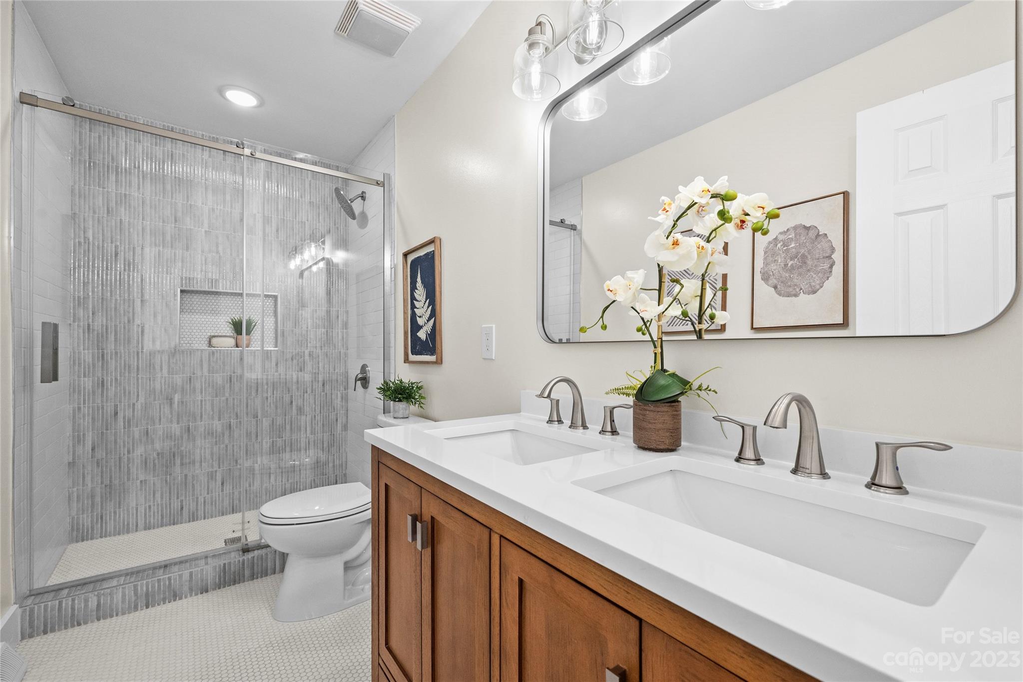 1621 Brook Drive Fort Mill, SC 29708 - Photo 17 of 30 a bathroom with a sink a toilet and shower