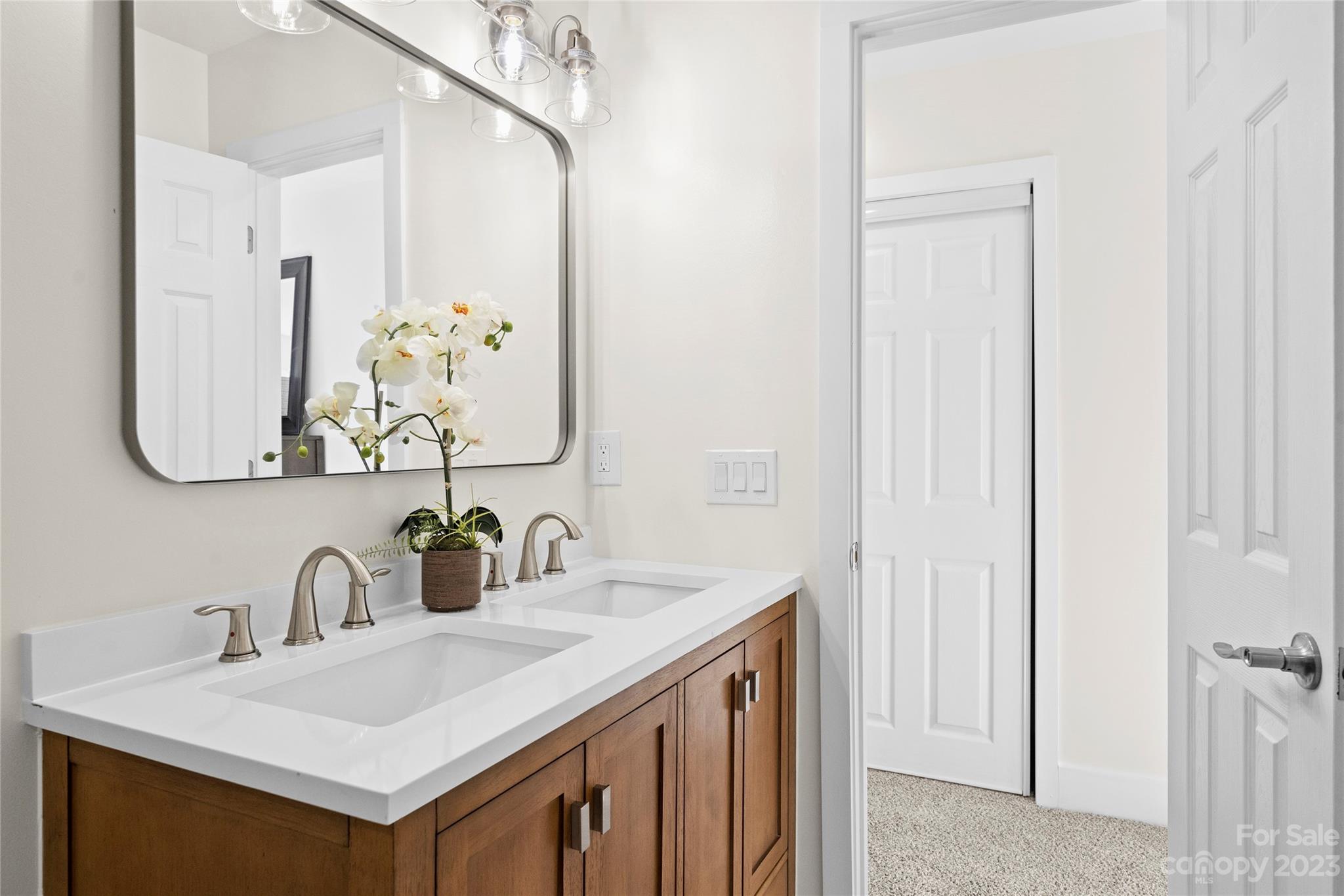 1621 Brook Drive Fort Mill, SC 29708 - Photo 19 of 30 a bathroom with a sink and a mirror