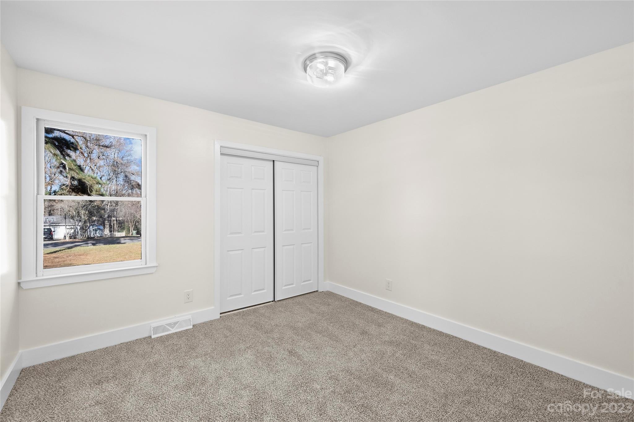 1621 Brook Drive Fort Mill, SC 29708 - Photo 20 of 30 an empty room with windows