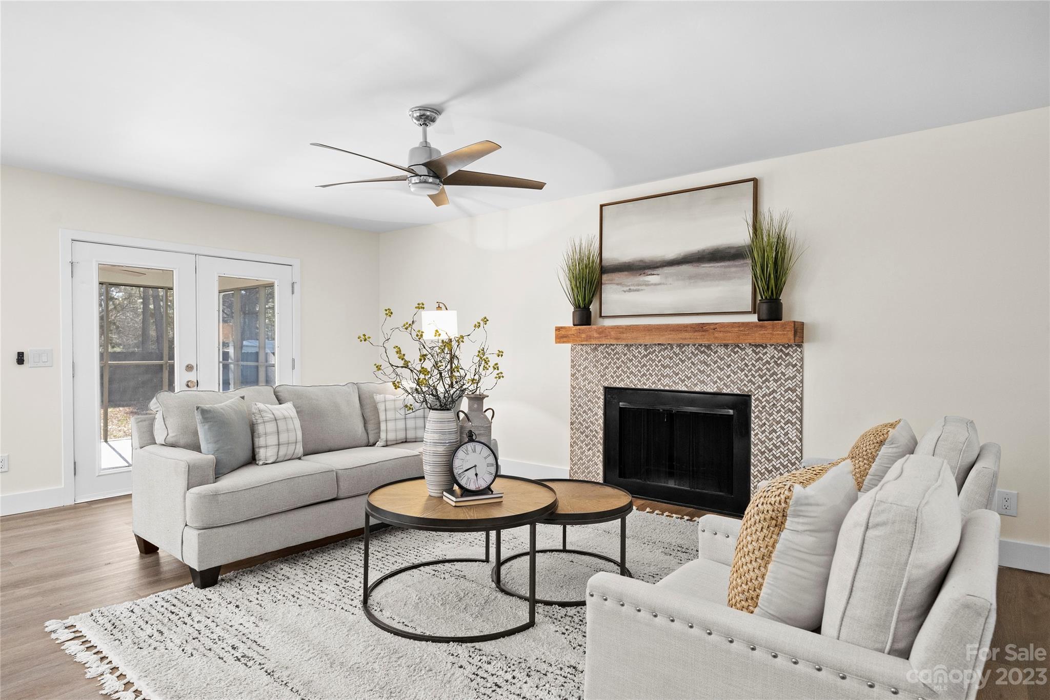 1621 Brook Drive Fort Mill, SC 29708 - Photo 2 of 30 a living room with furniture a fireplace and a table