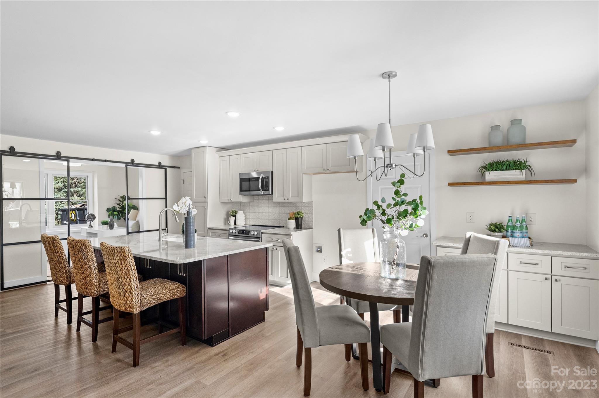 1621 Brook Drive Fort Mill, SC 29708 - Photo 3 of 30 a view of a dining room with furniture window and wooden floor