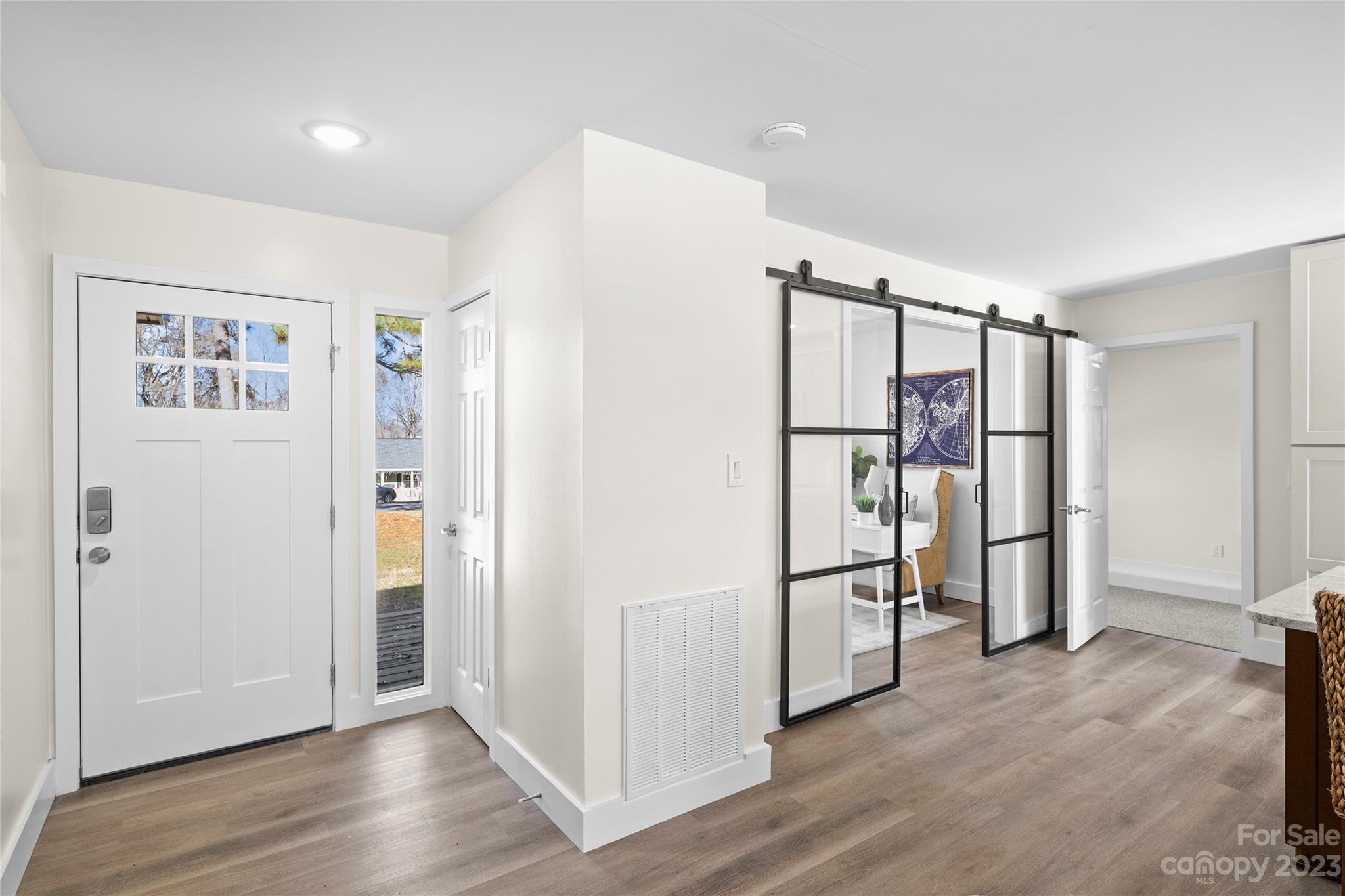 1621 Brook Drive Fort Mill, SC 29708 - Photo 9 of 30 a view of empty room with wooden floor and cabinets