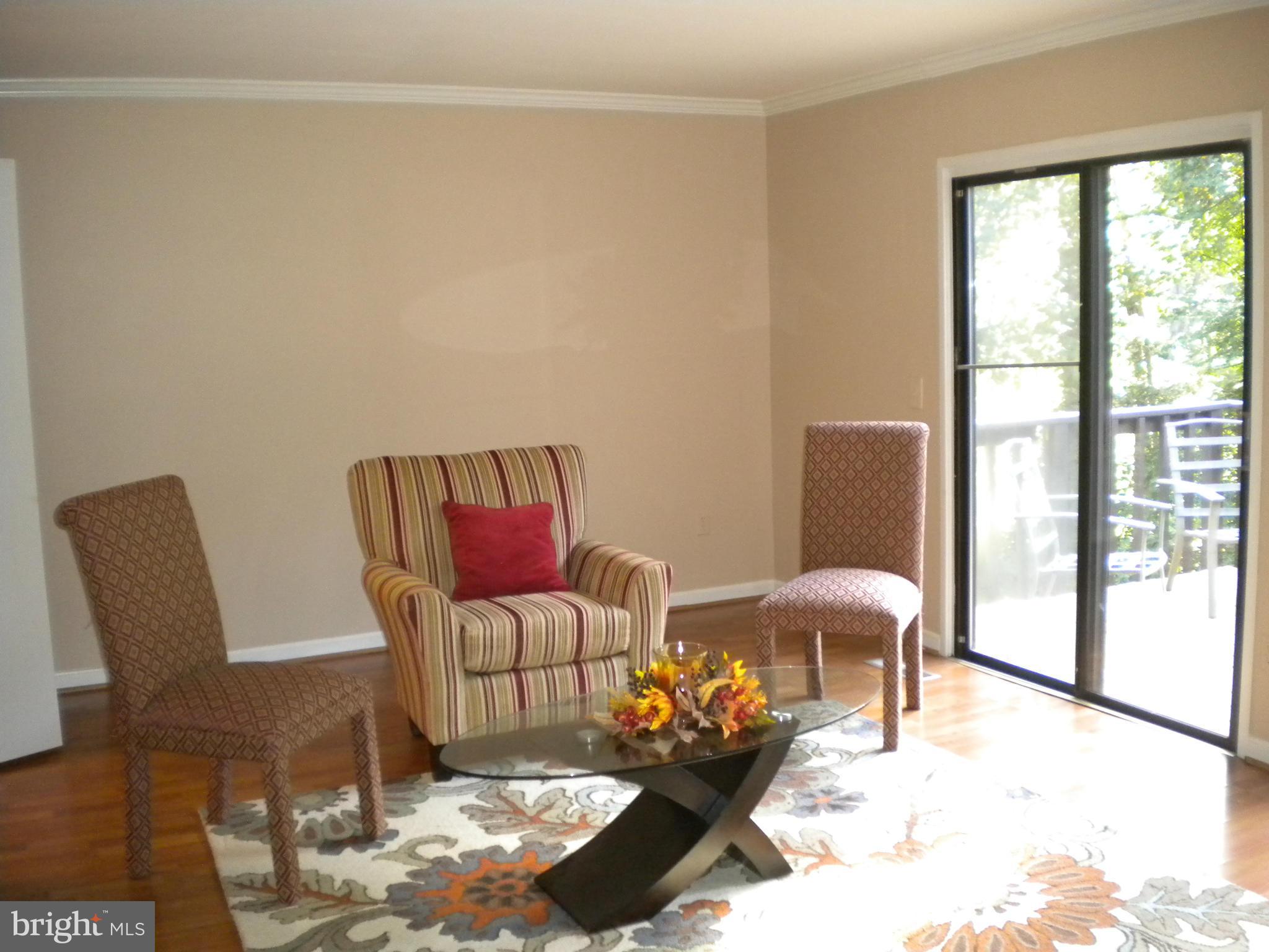 2266 Wheelwright Court Reston, VA 20191 - Photo 2 of 12 a living room with furniture and a floor to ceiling window