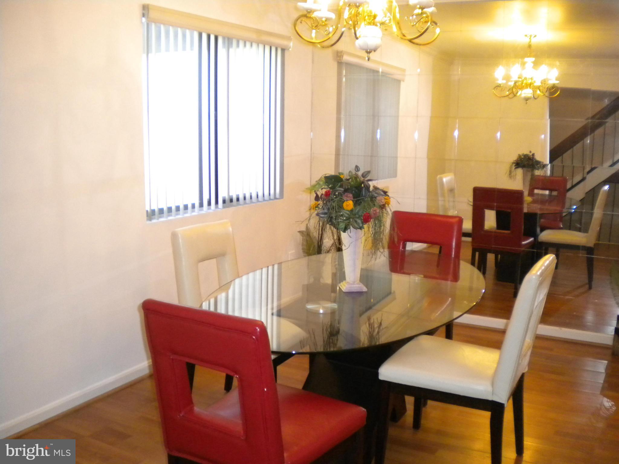 2266 Wheelwright Court Reston, VA 20191 - Photo 3 of 12 a view of a dining room with furniture window and wooden floor