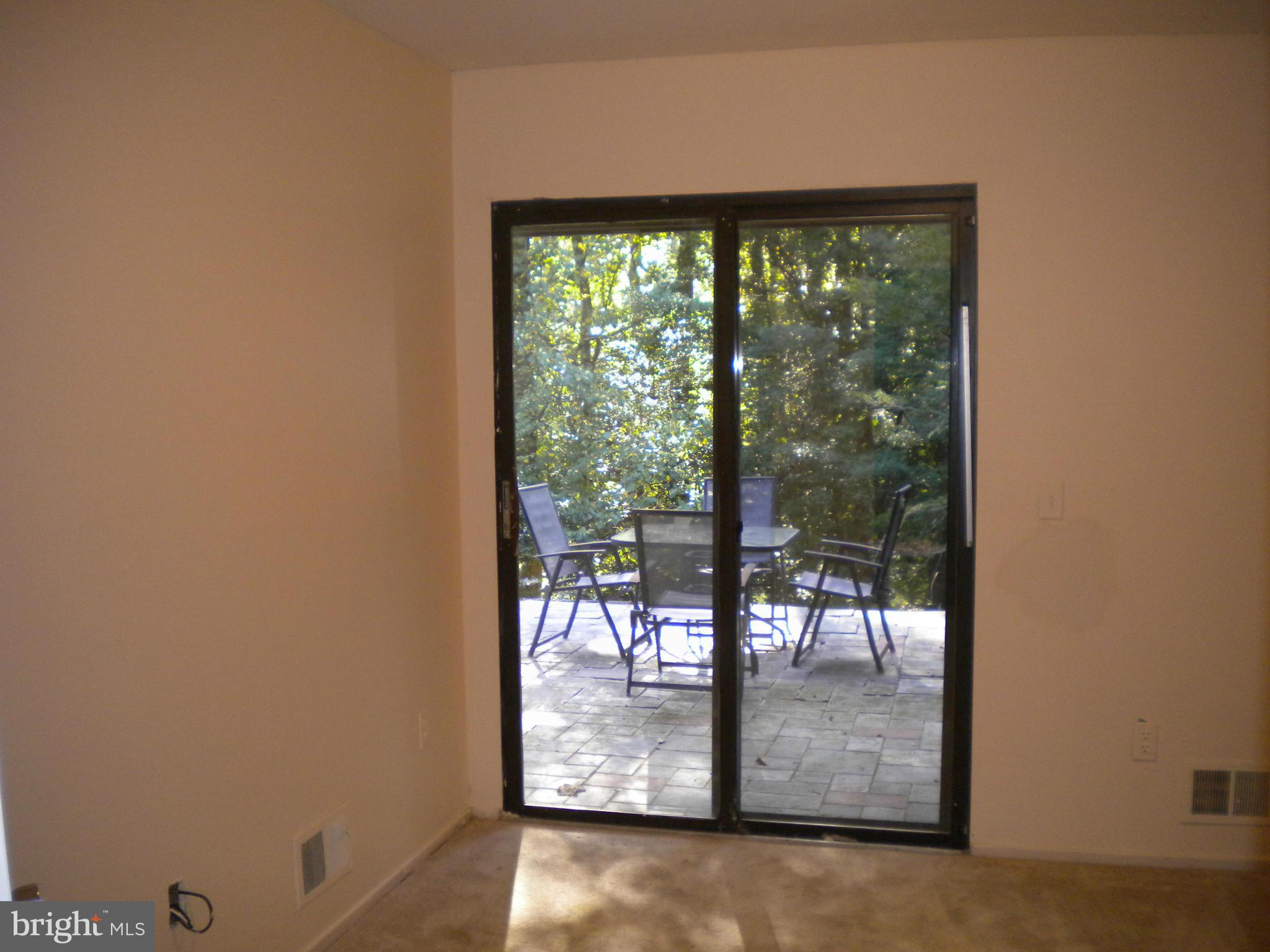 2266 Wheelwright Court Reston, VA 20191 - Photo 8 of 12 a view of a porch with chairs and backyard of a house
