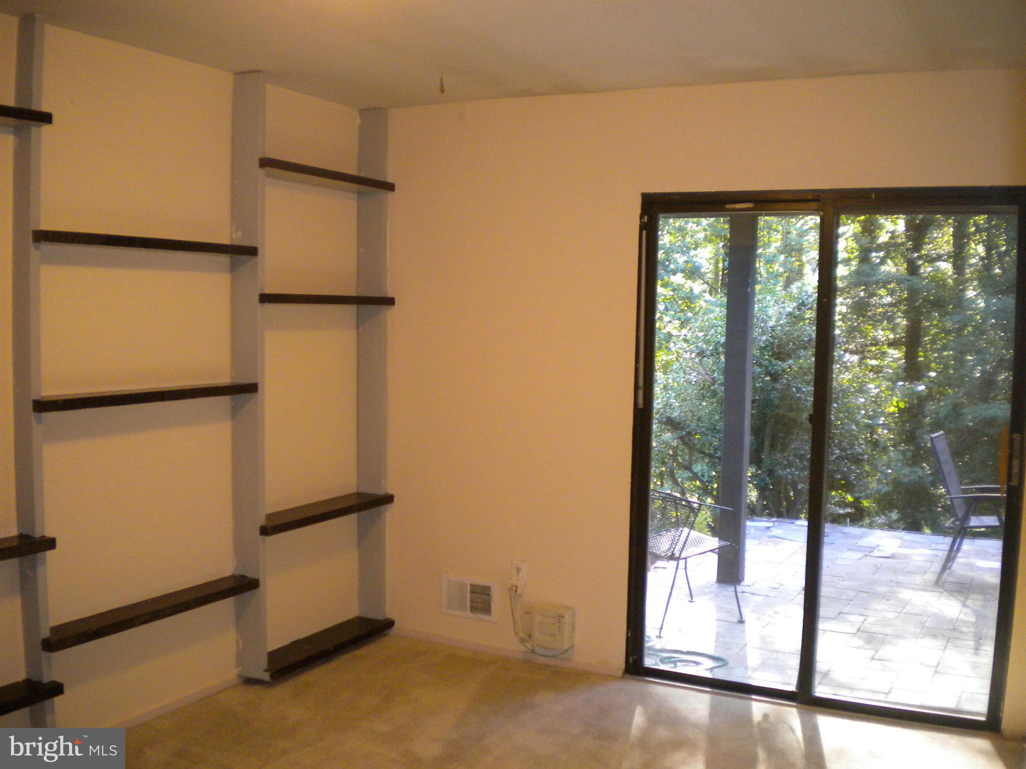 2266 Wheelwright Court Reston, VA 20191 - Photo 9 of 12 a view of an empty room with wooden floor and a window