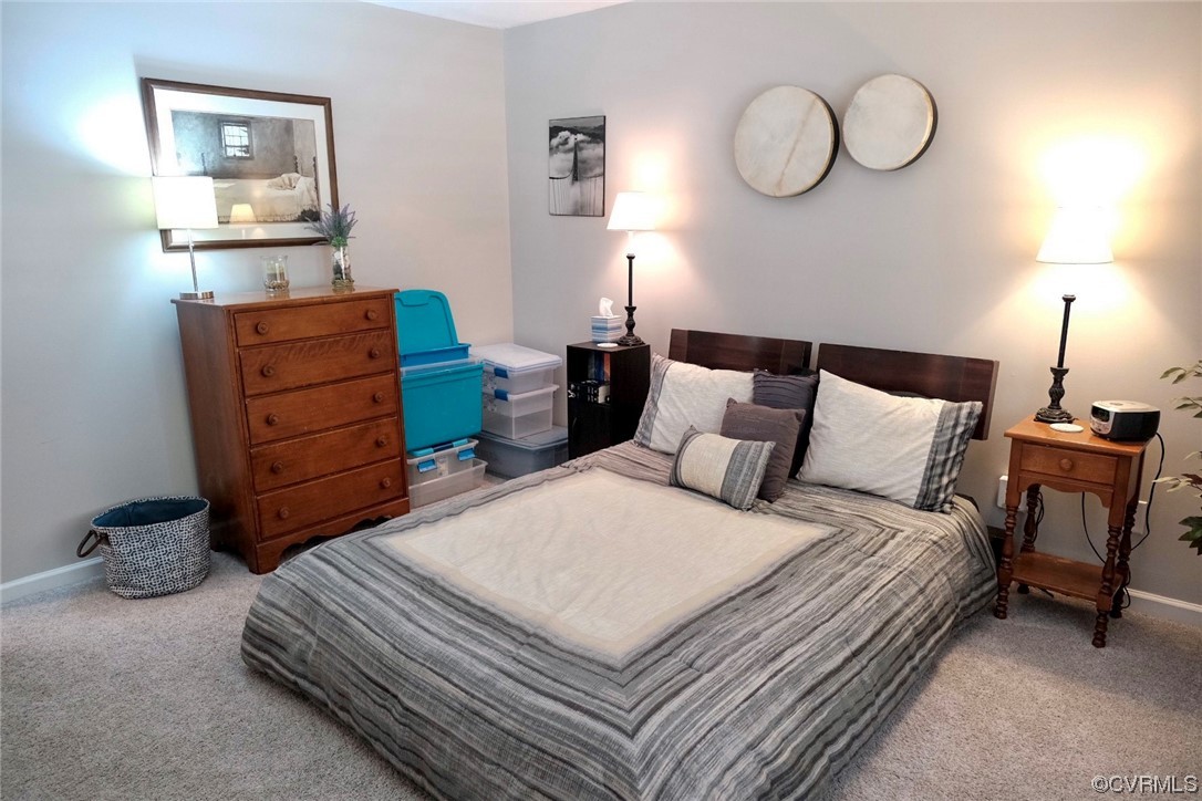 Undisclosed Address Aylett, VA 23009 - Photo 12 of 36 a bedroom with a bed and cabinets