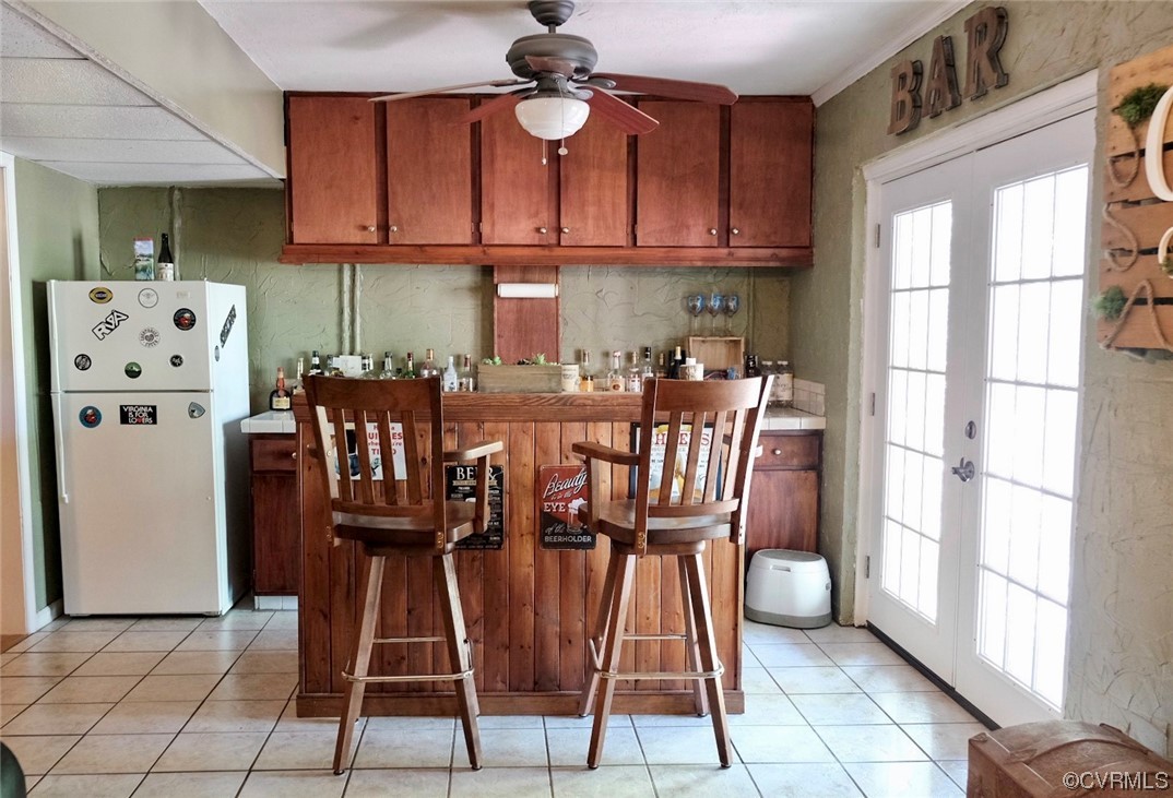 Undisclosed Address Aylett, VA 23009 - Photo 17 of 36 a dining room with granite countertop a dining table chairs and a refrigerator