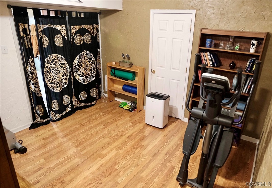 Undisclosed Address Aylett, VA 23009 - Photo 21 of 36 a view of a bedroom with wooden floor and furniture
