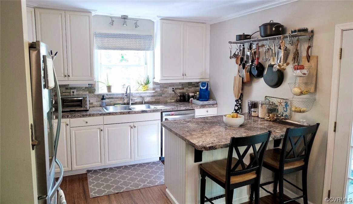 Undisclosed Address Aylett, VA 23009 - Photo 6 of 36 a kitchen with a sink a table and chairs