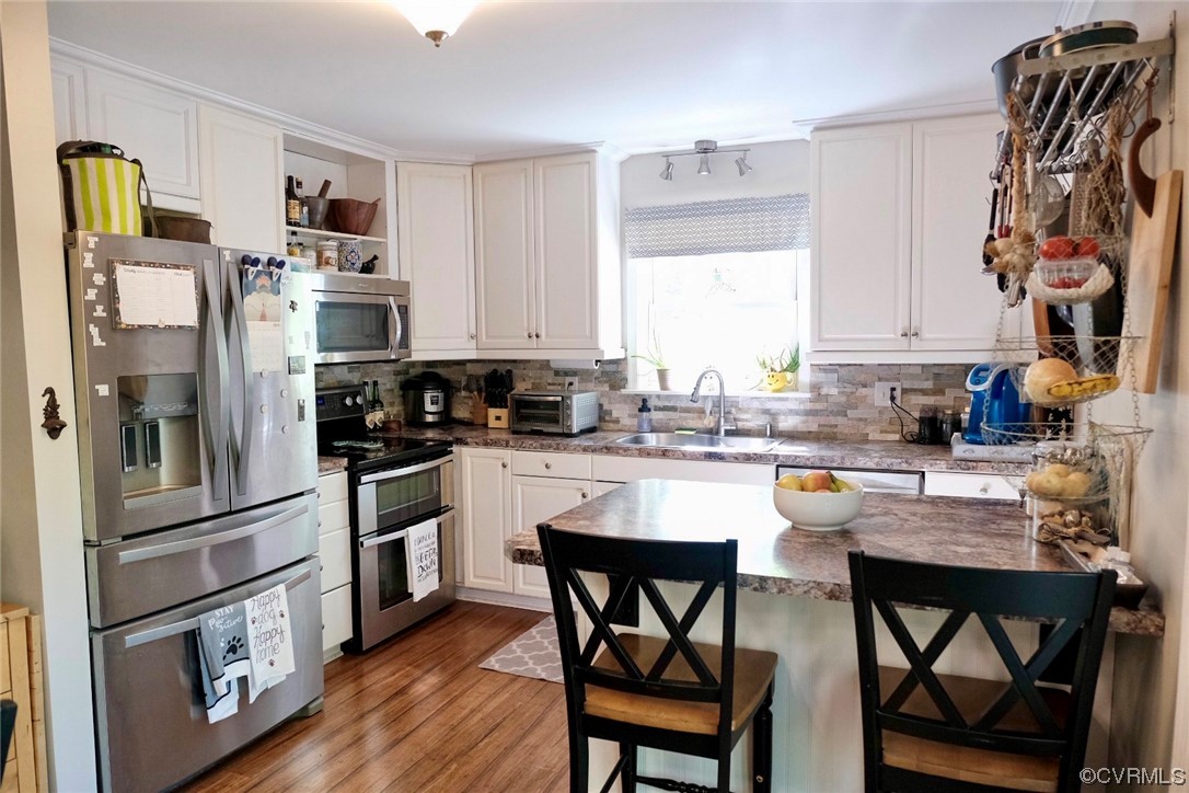 Undisclosed Address Aylett, VA 23009 - Photo 7 of 36 a kitchen with stainless steel appliances granite countertop a refrigerator sink and cabinets