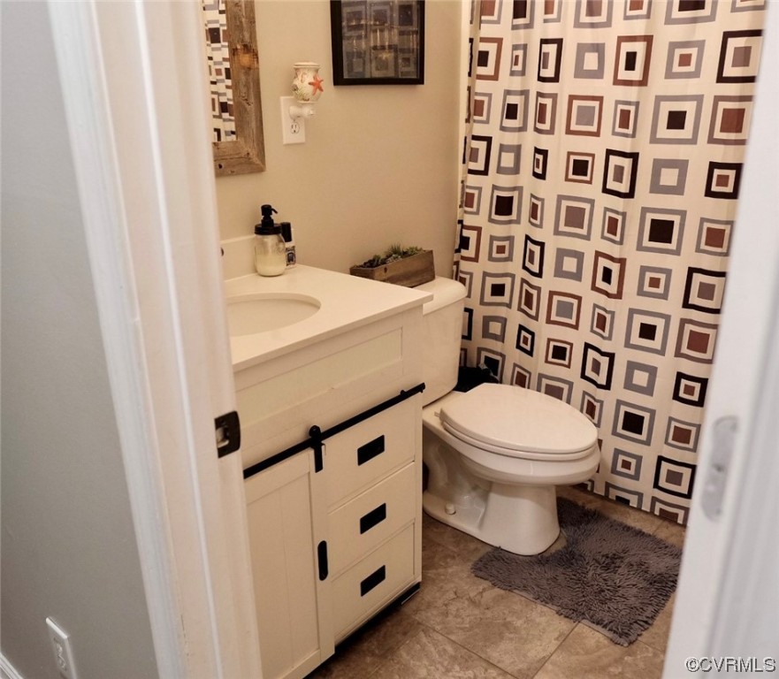 Undisclosed Address Aylett, VA 23009 - Photo 9 of 36 a white toilet sitting next to a bathroom sink