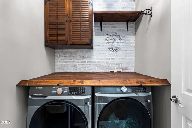 a view of a livingroom with a ceiling fan and window