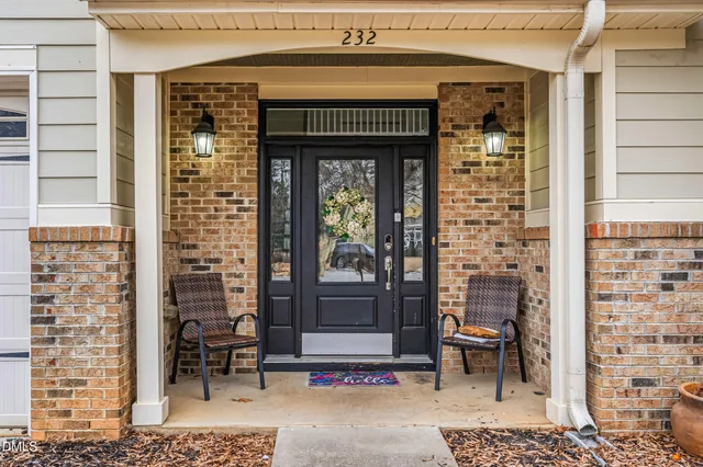 a front view of a building with outdoor seating
