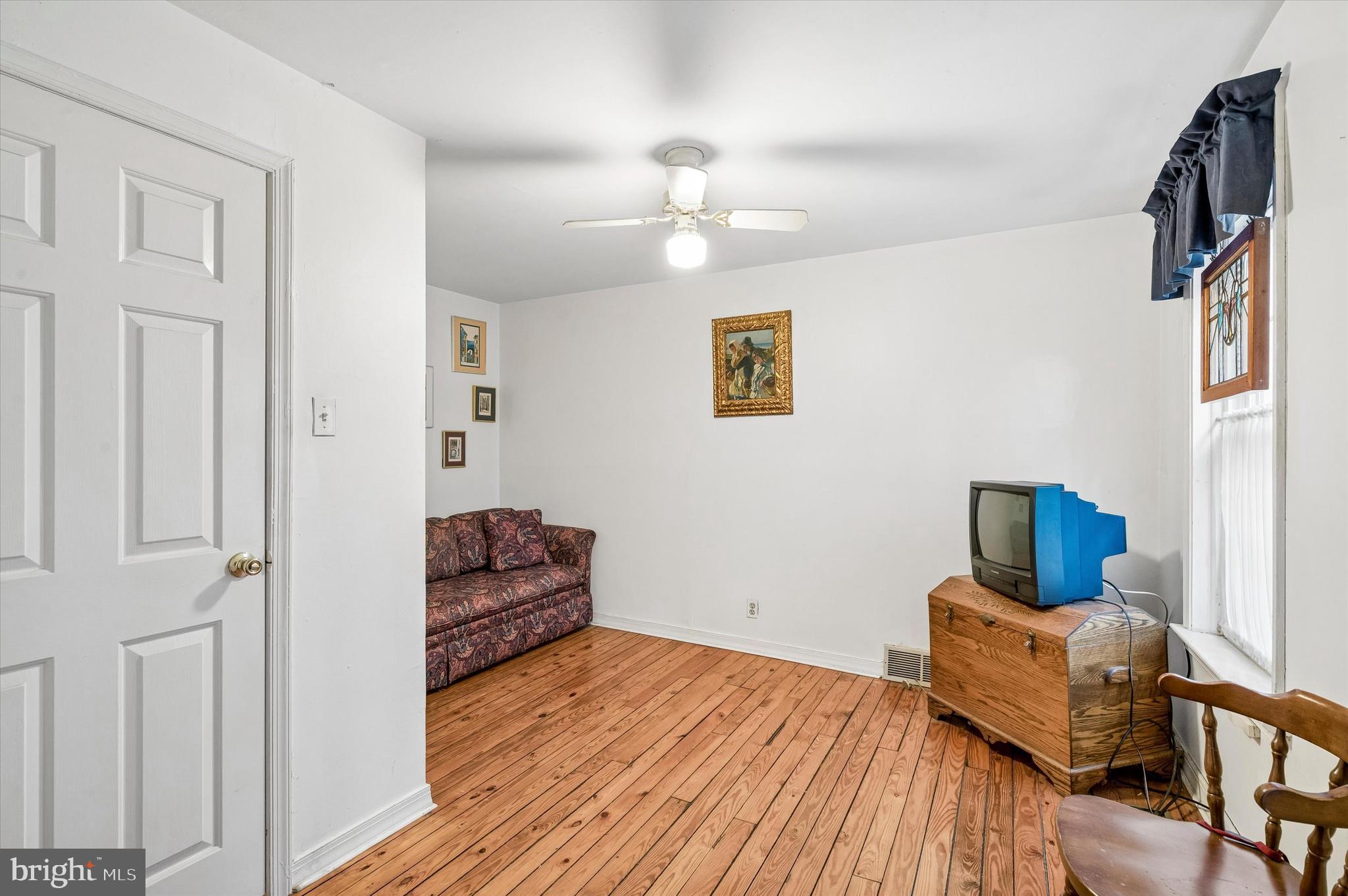 2119 Rodman Street Philadelphia, PA 19146 - Photo 16 of 24 a bedroom with furniture and wooden floor