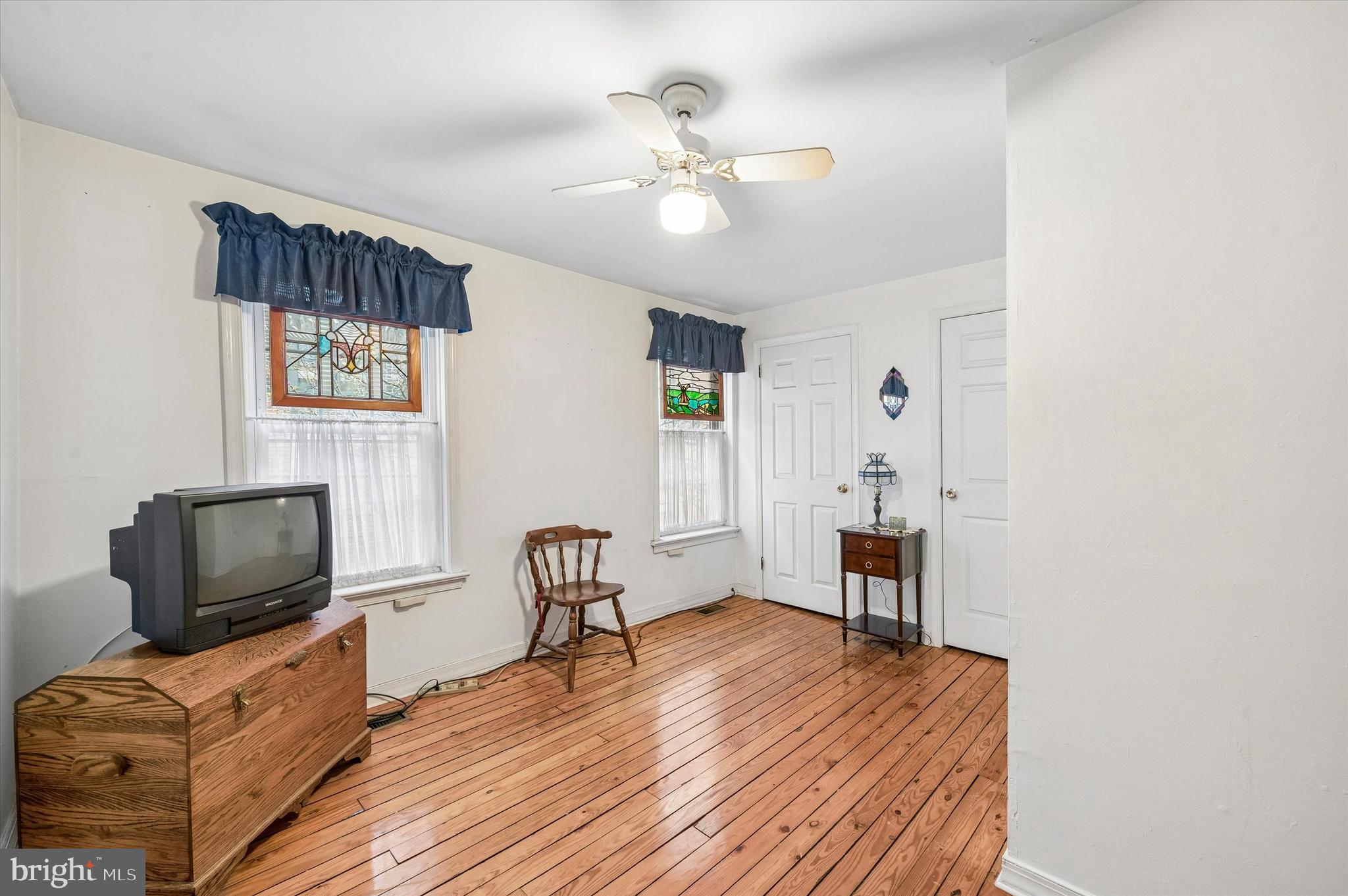 2119 Rodman Street Philadelphia, PA 19146 - Photo 17 of 24 a view of a livingroom with furniture and a flat screen tv