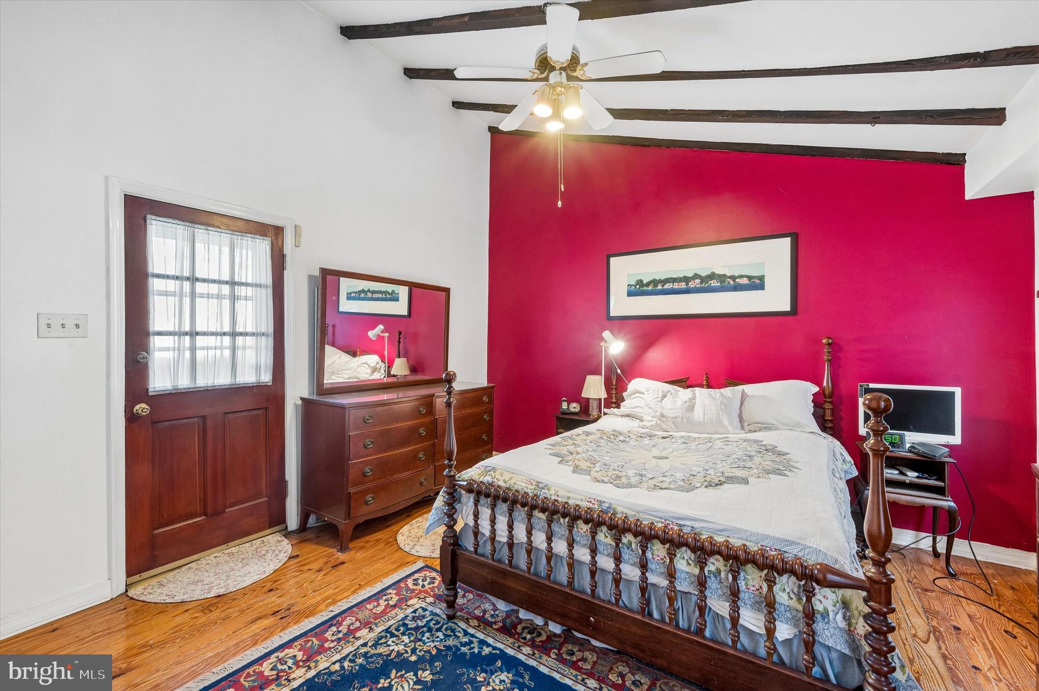 2119 Rodman Street Philadelphia, PA 19146 - Photo 21 of 24 a bedroom with a bed and a flat screen tv