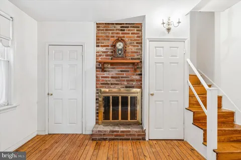 a view of front door with wooden floor