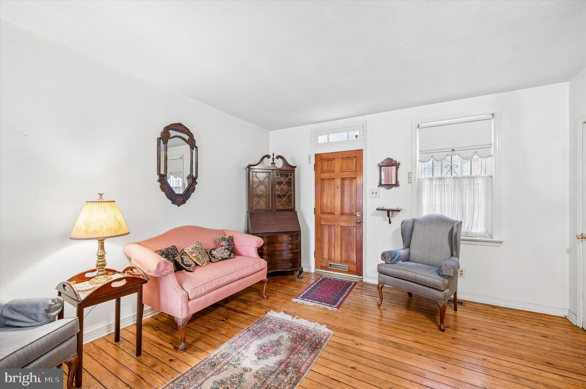 2119 Rodman Street Philadelphia, PA 19146 - Photo 5 of 24 a living room with furniture a rug and a window