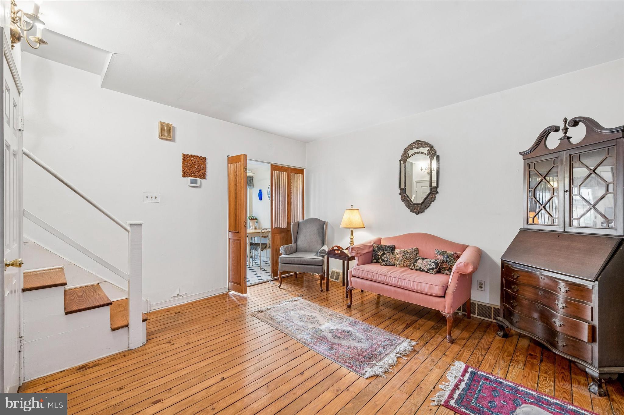 2119 Rodman Street Philadelphia, PA 19146 - Photo 7 of 24 a living room with furniture a rug and a window