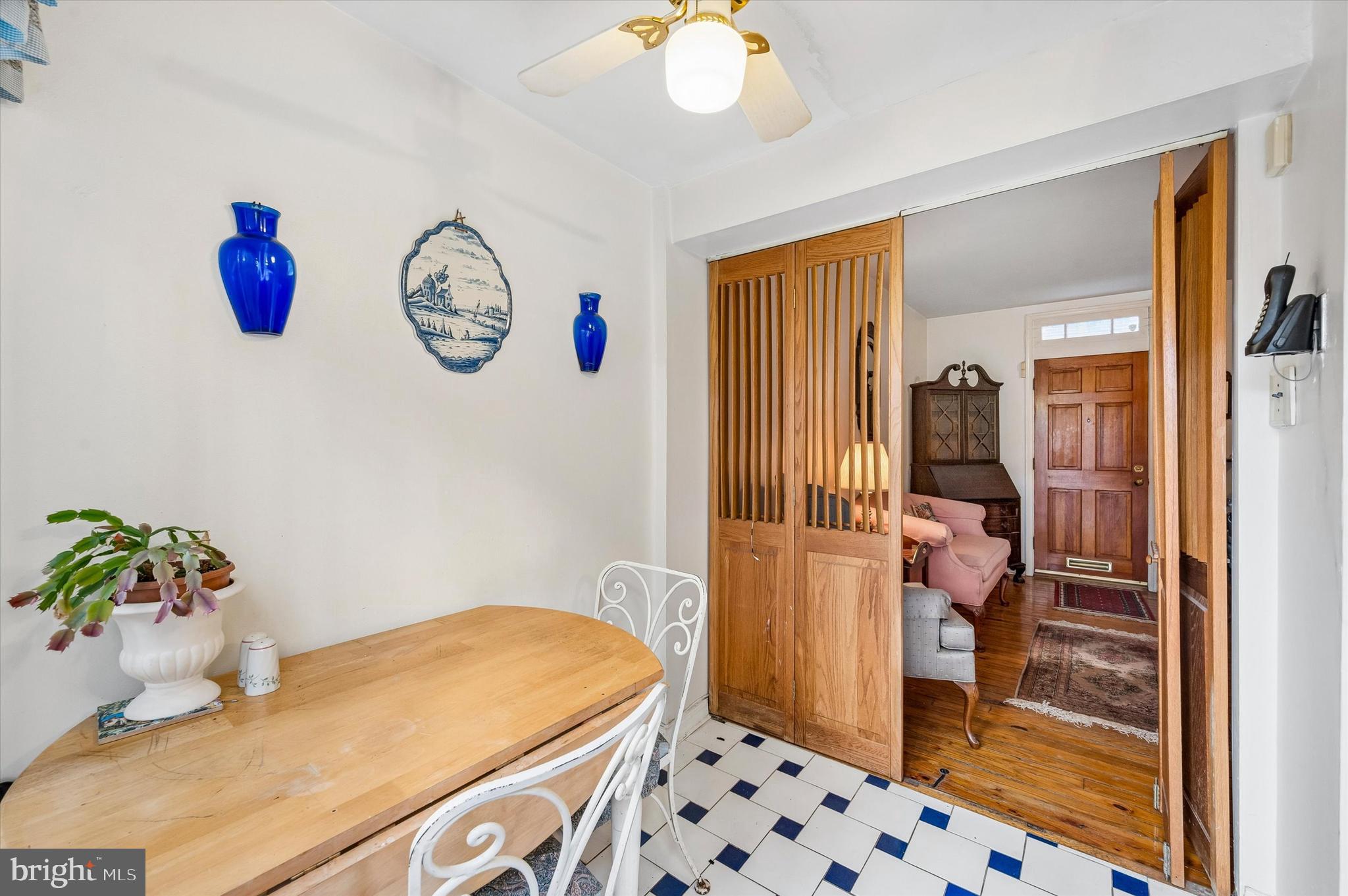 2119 Rodman Street Philadelphia, PA 19146 - Photo 8 of 24 a bedroom with a bed and a chandelier