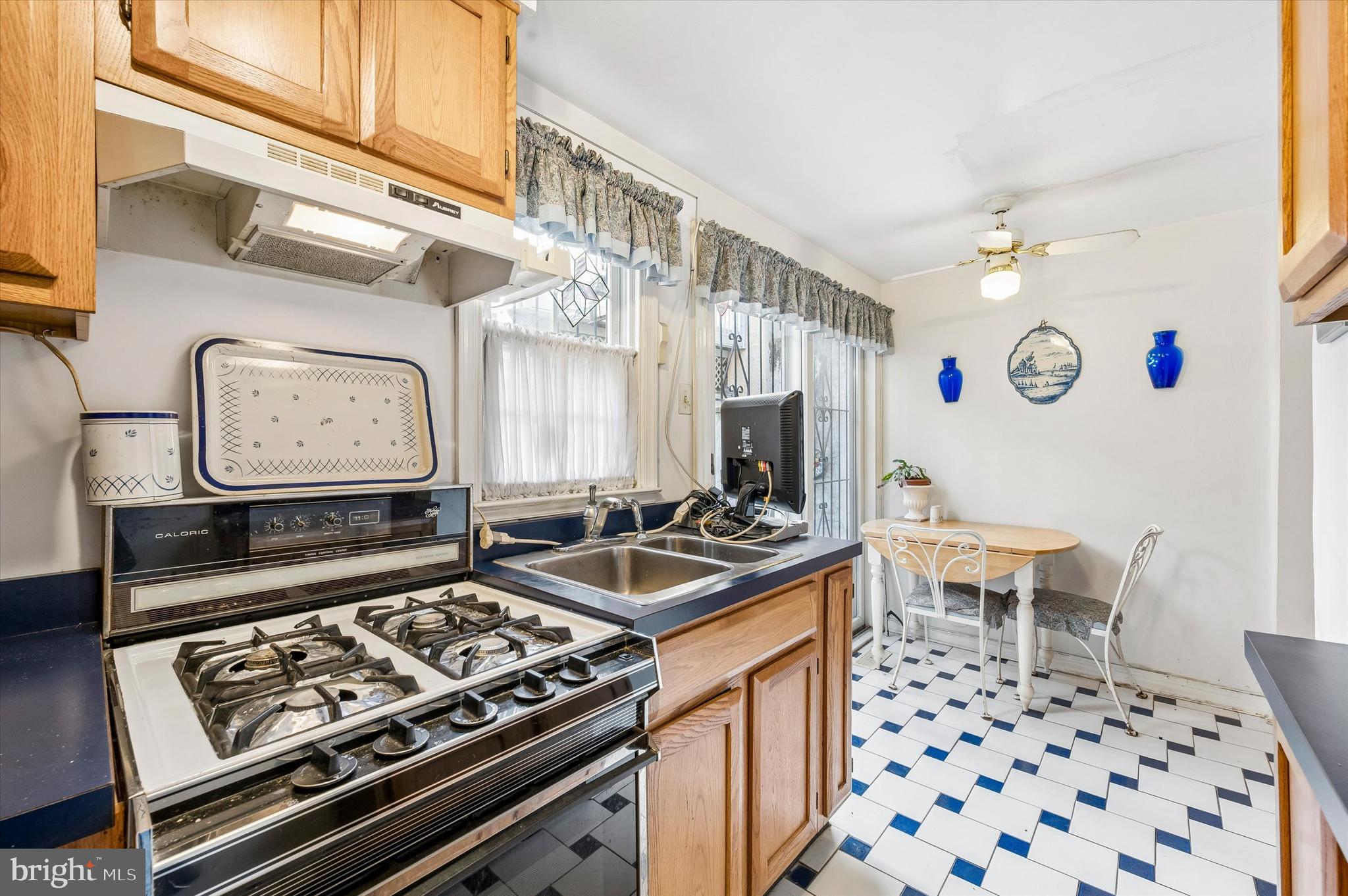 2119 Rodman Street Philadelphia, PA 19146 - Photo 10 of 24 a kitchen with stainless steel appliances a stove a sink and a refrigerator