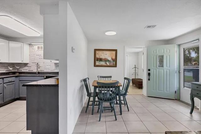 a kitchen with appliances and cabinets