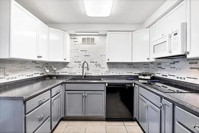 a living room filled with furniture and a large window