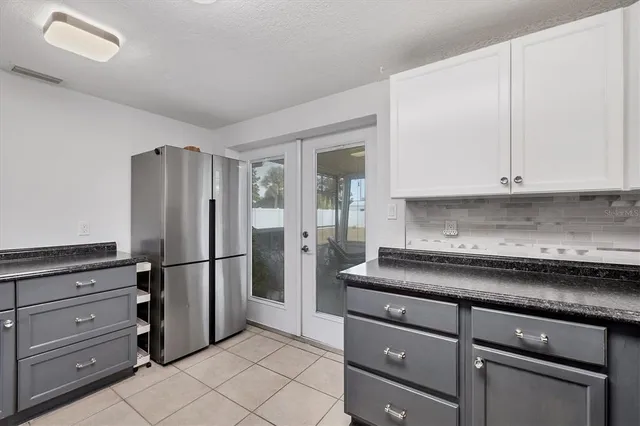 a room that has a window and a table in it