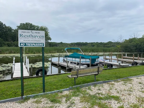 a view of a chairs and table on the garden