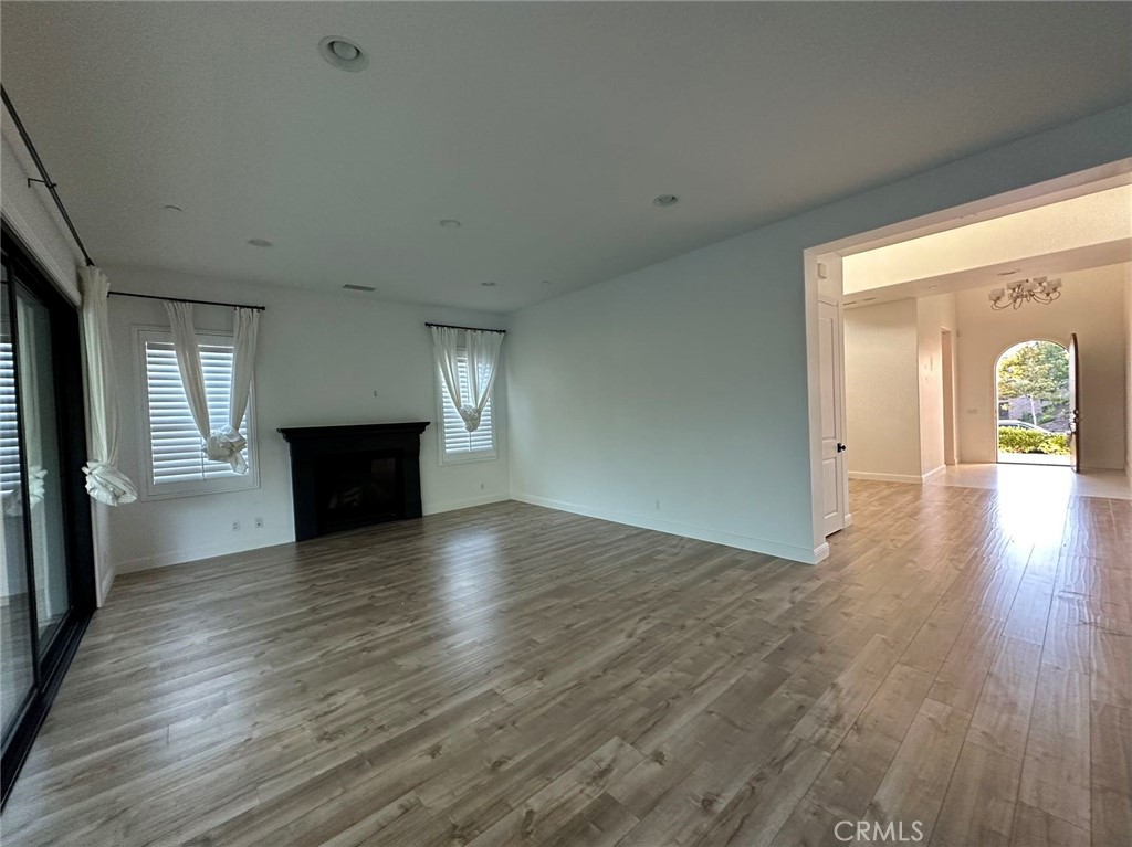 20 Hyacinth Lake Forest, CA 92630 - Photo 12 of 25 a view of empty room with wooden floor and fireplace
