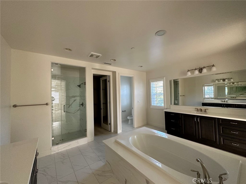 20 Hyacinth Lake Forest, CA 92630 - Photo 18 of 25 a spacious bathroom with a tub sink shower and mirror