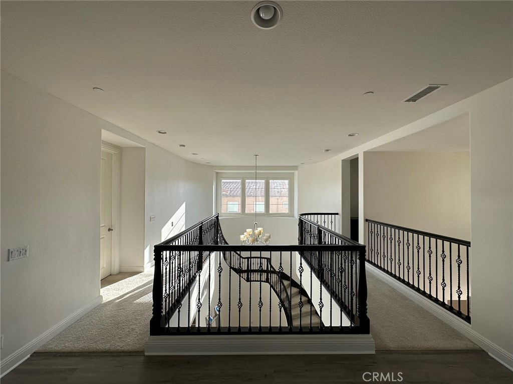 20 Hyacinth Lake Forest, CA 92630 - Photo 23 of 25 a view of entryway bedroom and hall with wooden floor