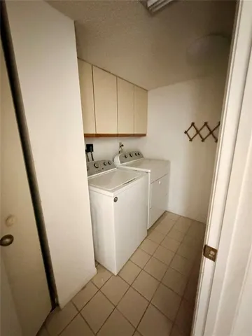 a kitchen with a refrigerator a sink and a stove top oven