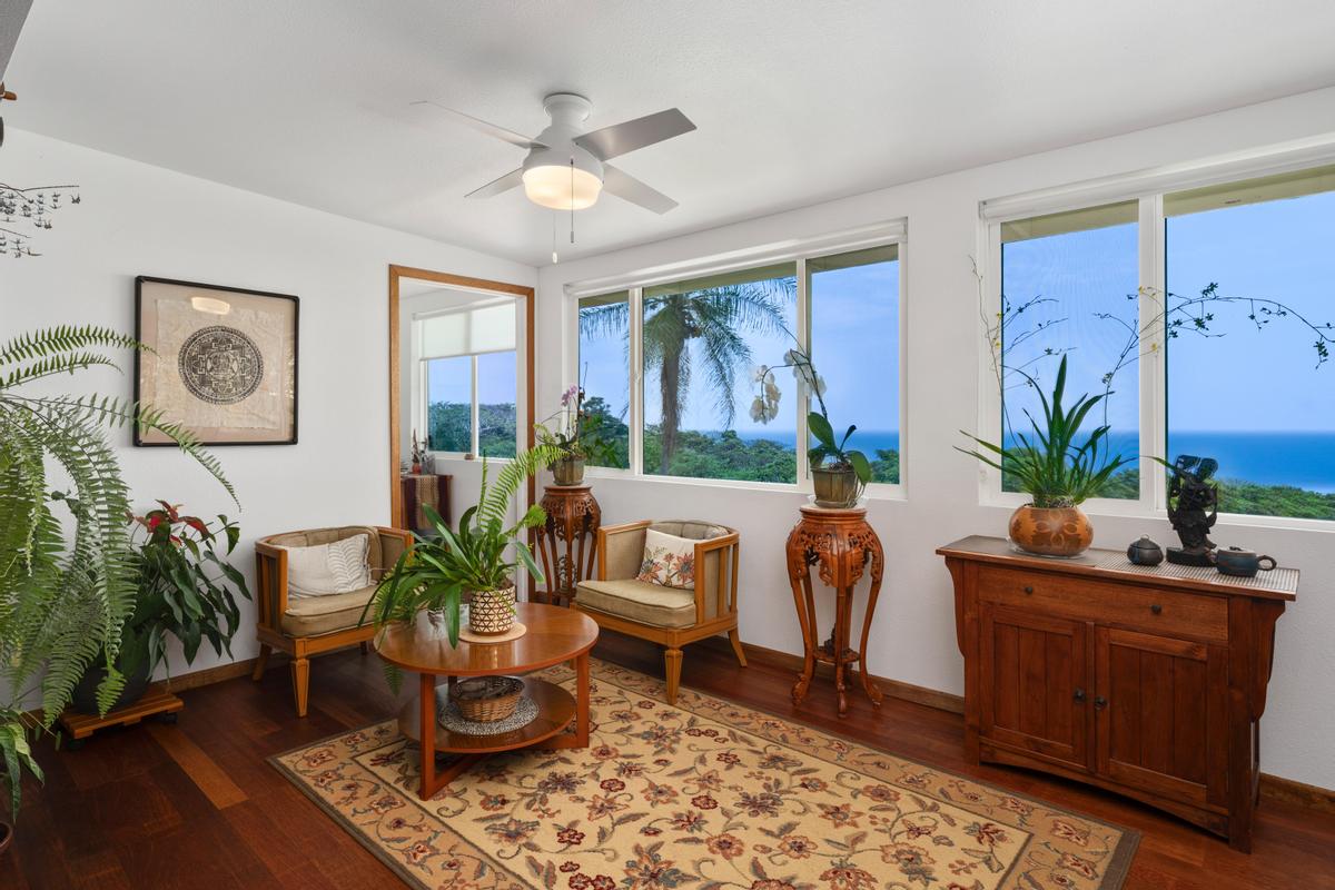 85-4563 Hawaii Belt Road Captain Cook, HI 96704 - Photo 9 of 30 a living room with furniture and a large window