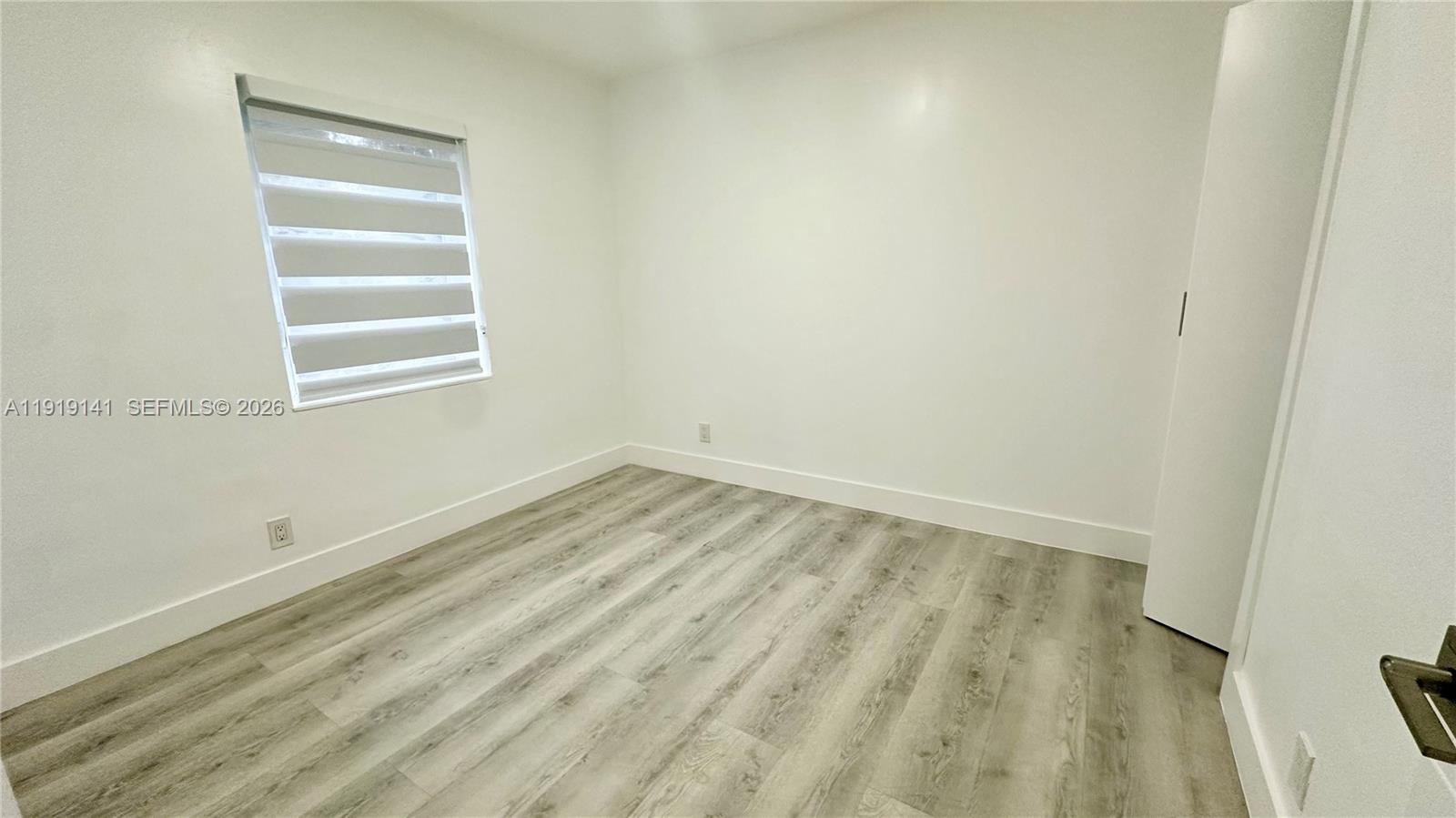 1269 Northeast 145th Street Miami, FL 33161 - Photo 18 of 25 a view of a room that has a window in it