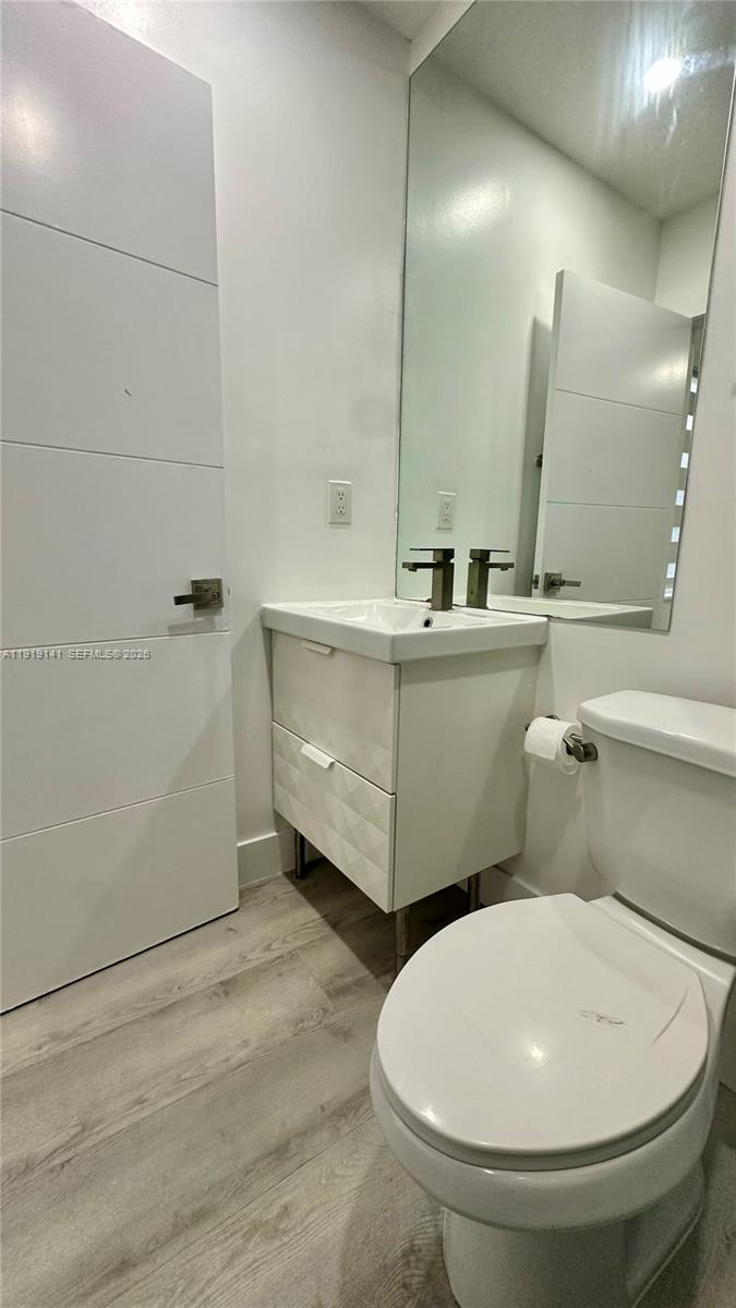 1269 Northeast 145th Street Miami, FL 33161 - Photo 24 of 25 a bathroom with 2 sink and a mirror