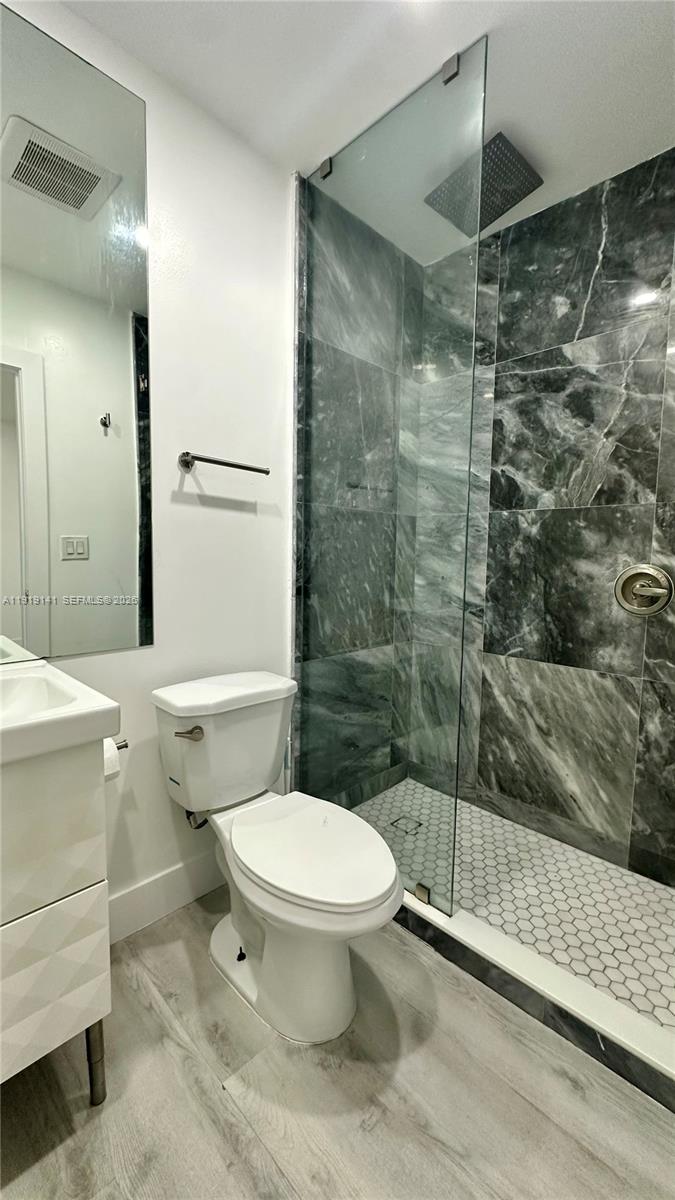 1269 Northeast 145th Street Miami, FL 33161 - Photo 25 of 25 a bathroom with a shower and a toilet