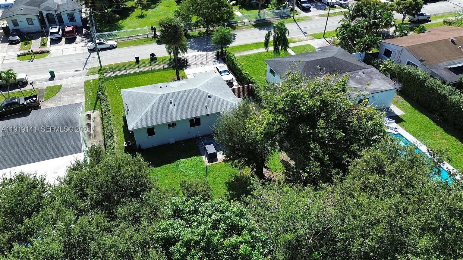 1269 Northeast 145th Street Miami, FL 33161 - Photo 6 of 25 an aerial view of a house with a yard