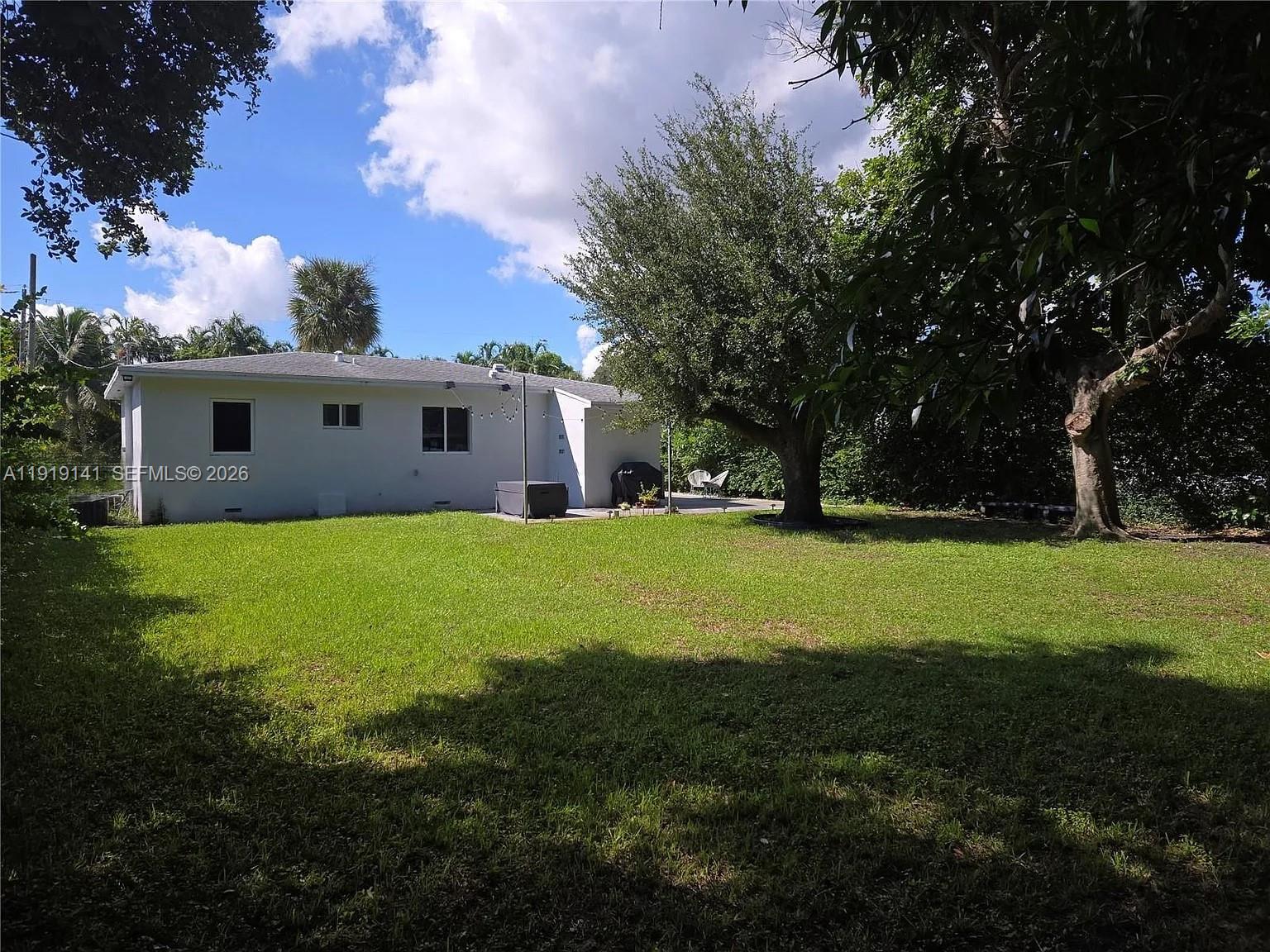 1269 Northeast 145th Street Miami, FL 33161 - Photo 7 of 25 a view of house with backyard